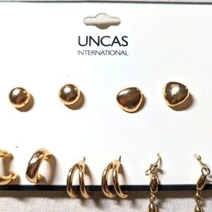 Uncas international set of five pairs earrings in golden tones.